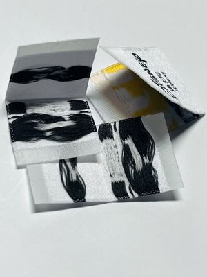 Ετικέτες ρούχων από υφαντικές ίνες Ετικέτες ρούχων 0.4mm Ετικέτα 5000pcs